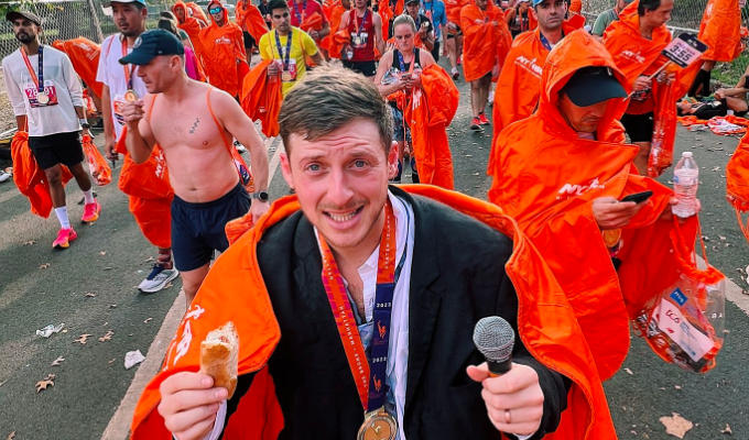 Jack Tucker 'runs' the New York Marathon | Comic crossing finish line with hot dog... and his mic