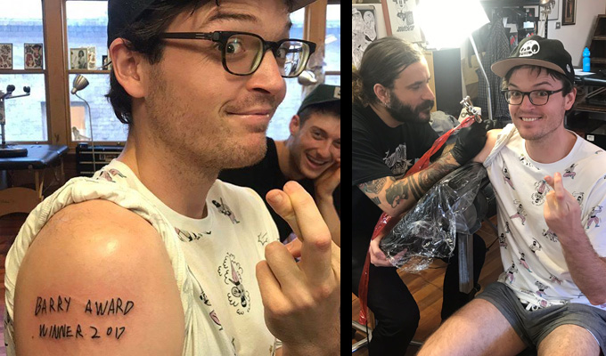 Tat's tempting fate... | Comic has 'Barry winner' inked on his arm, before the results are announced