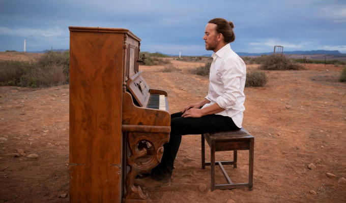 The piano is a cross he's bearing for his sins... | Tim Minchin on his new series Upright