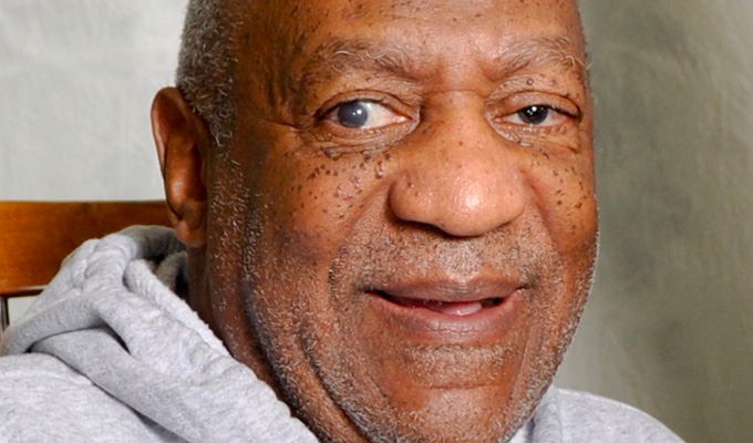 Bill Cosby's retrial begins | ...with a topless protester outside court