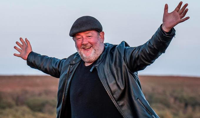 Johnny looking happy in a field