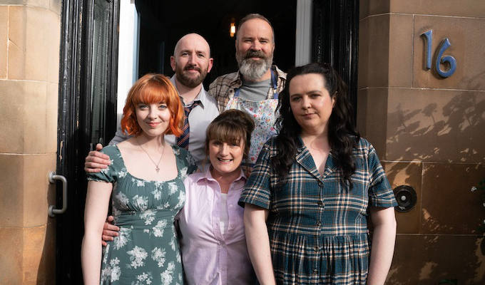 family posing on the doorstep