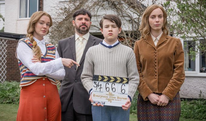 The Lewis family with a clapperboard showing S2