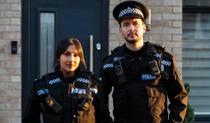 Rana and Pickles in police uniform