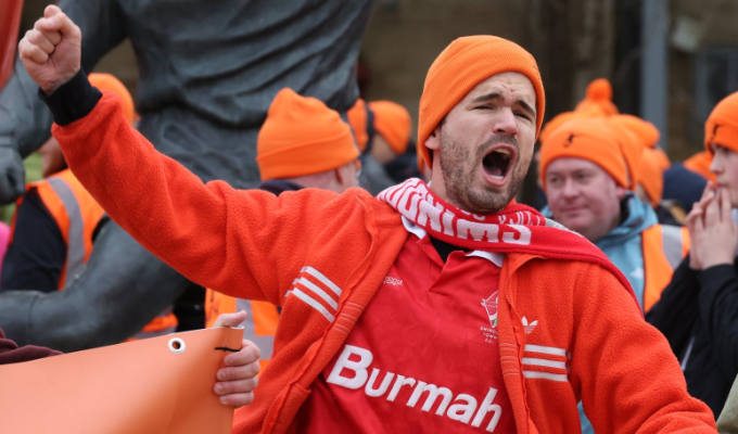 Ivo weaaring orange beanie in Swindon Town protest