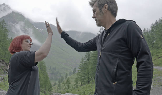 Rhod and Angela high-fiving after their drive