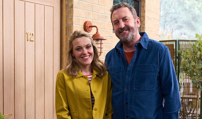 Lee and Sally outside a house