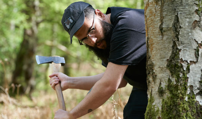 Jamali on Outsiders attacking tree with an axe