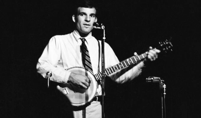 Steve playing the banjo in an old black and white picture
