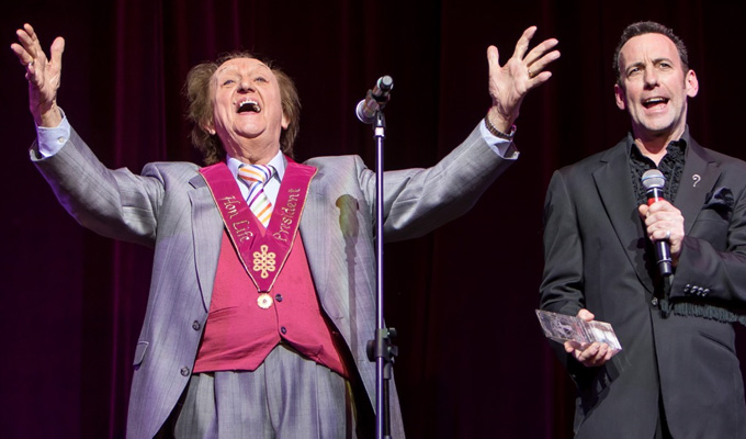 A magic moment | Paul Zenon collects an award from Ken Dodd